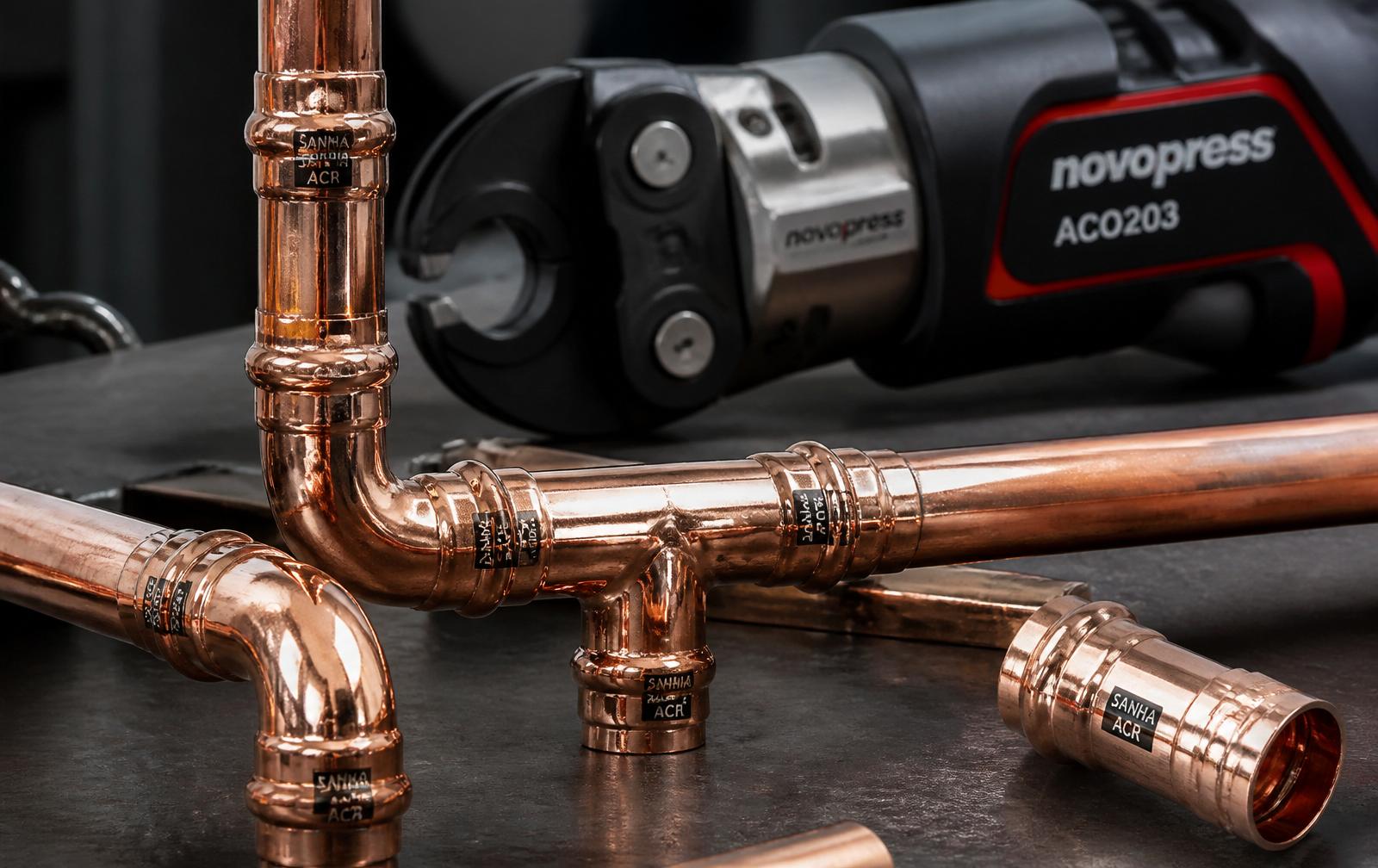 Novopress press tool crimping a copper fitting